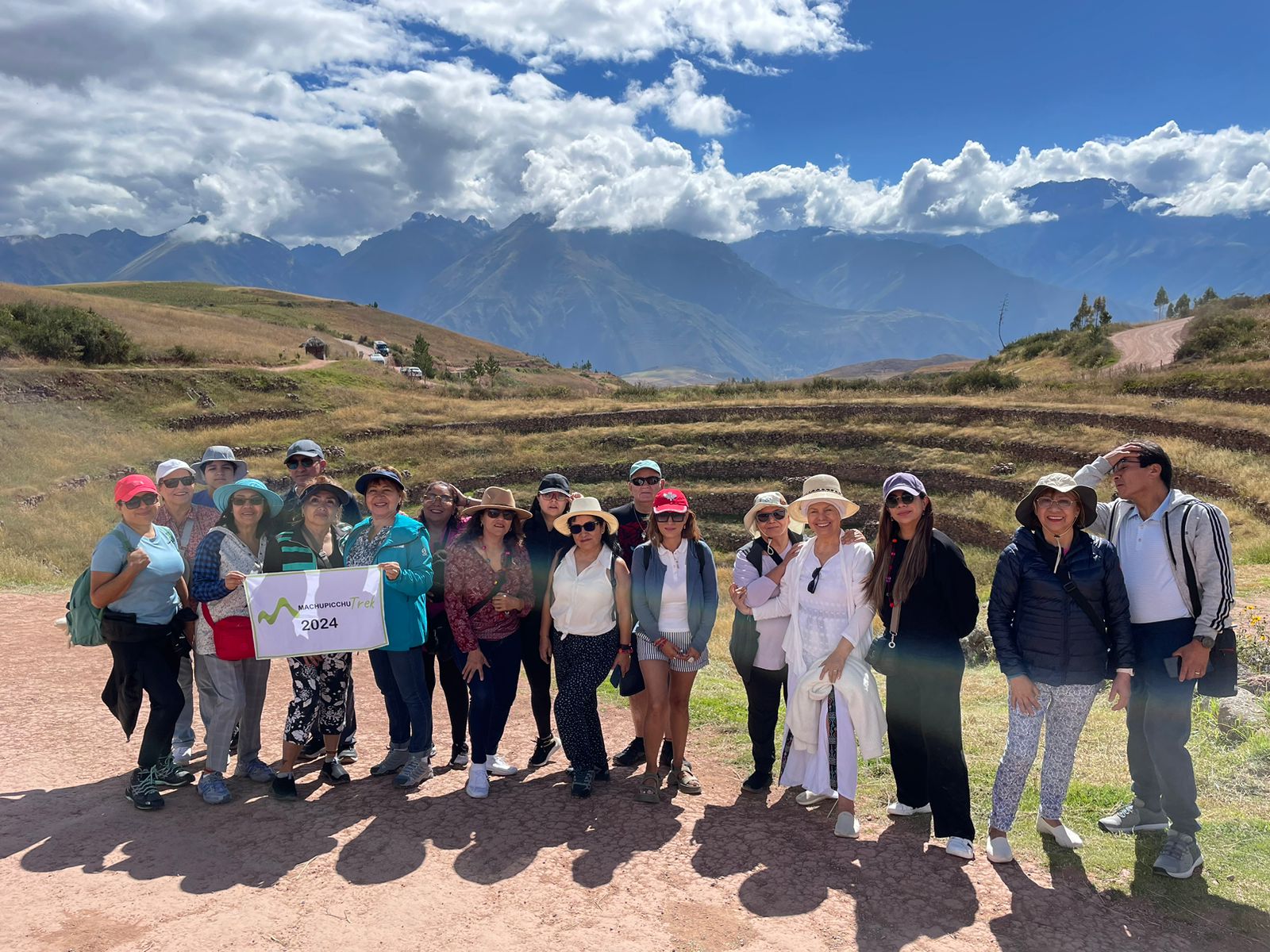 XJCC6705 Group posing in scenic mountain landscape.