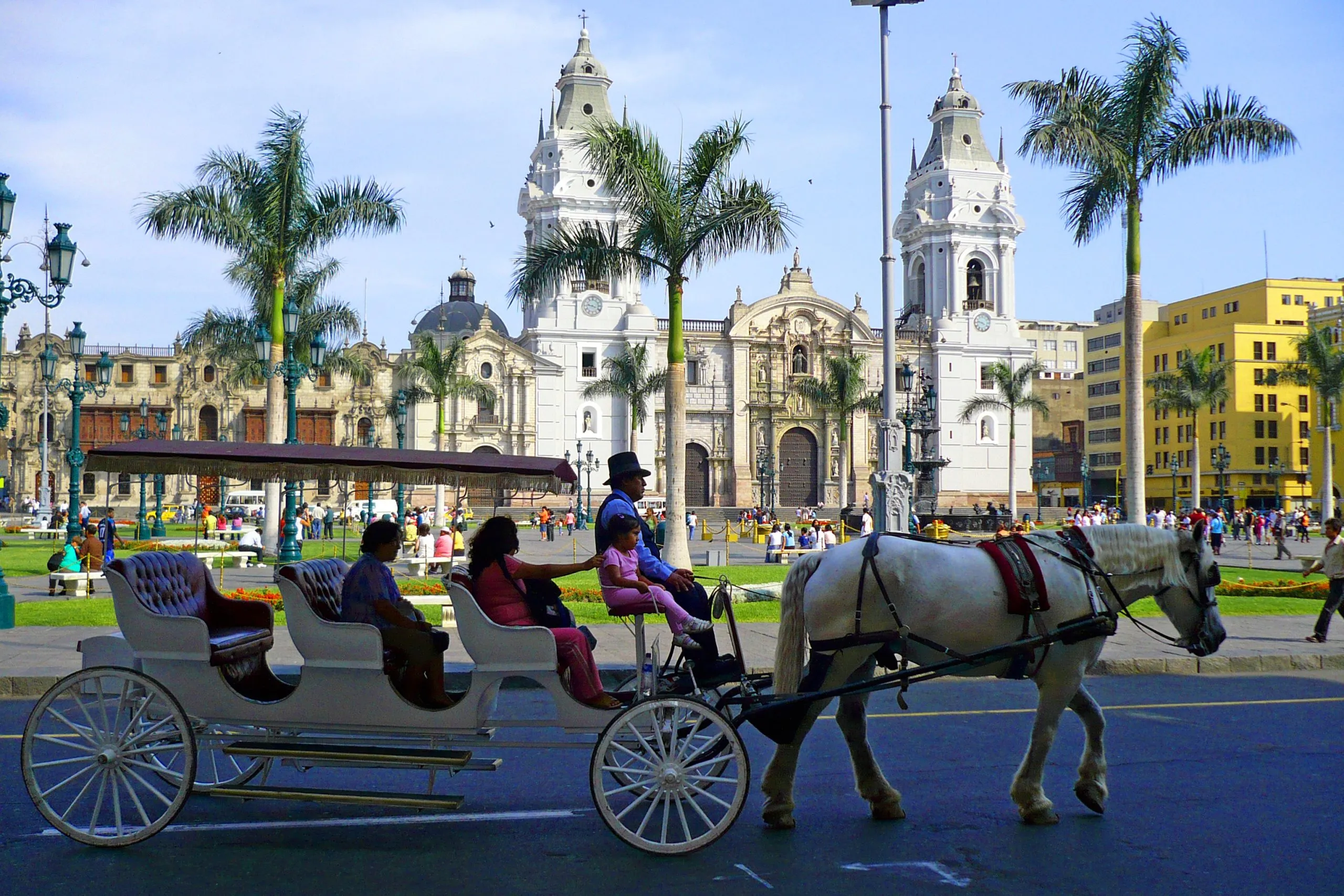 Horse-drawn carriage in historic plaza, Lima, Peru.