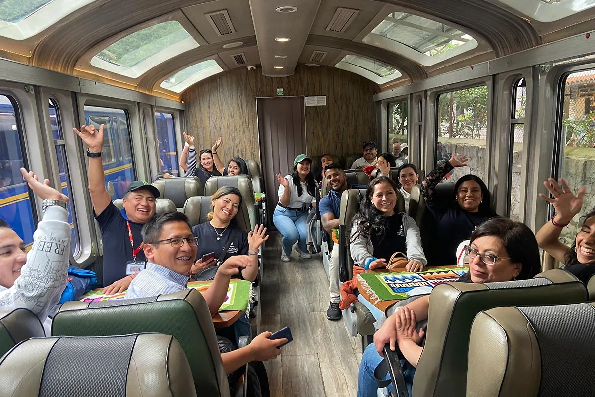 Group smiling inside a train car
